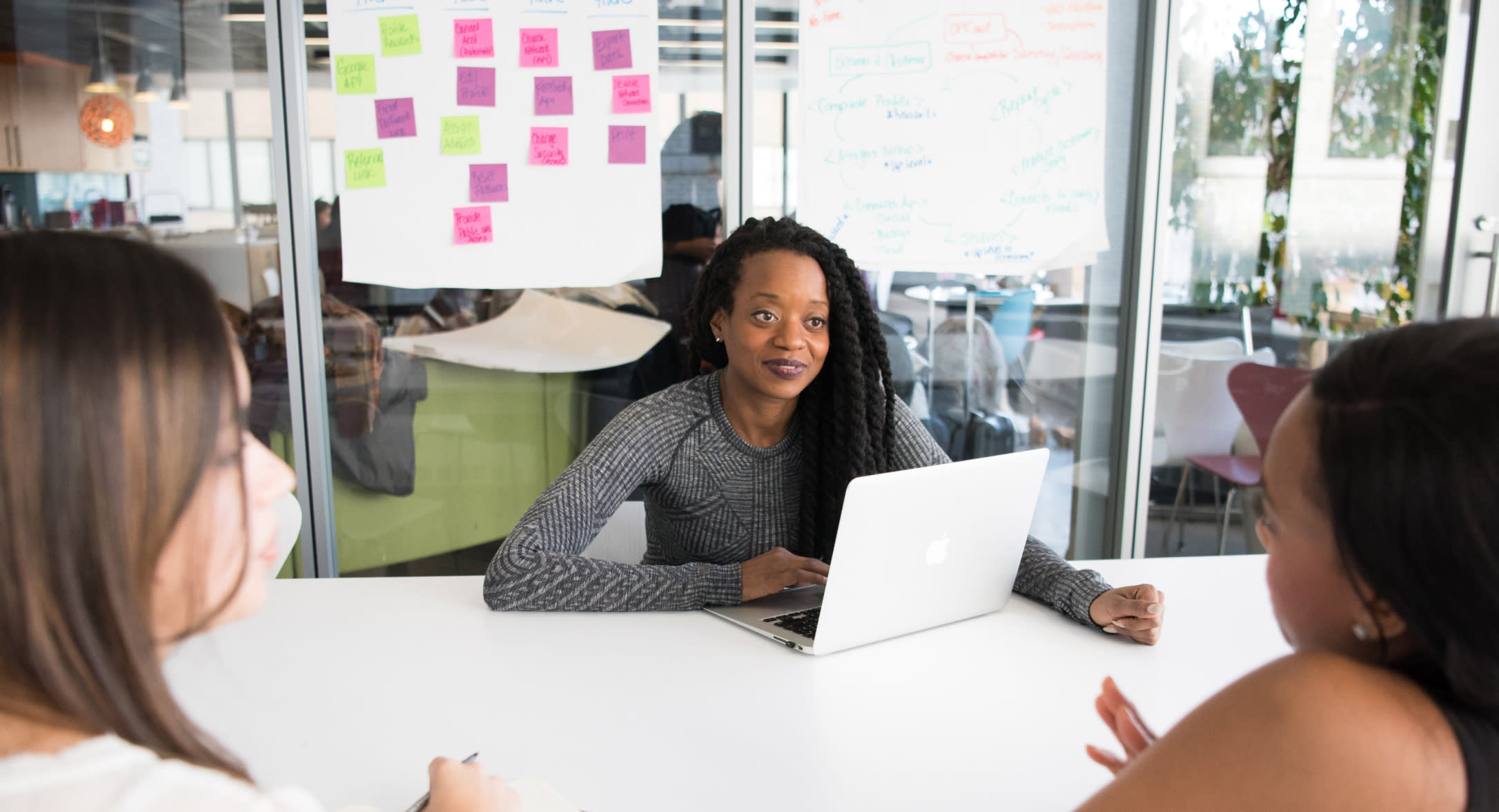 Three women meeting in an office conference room