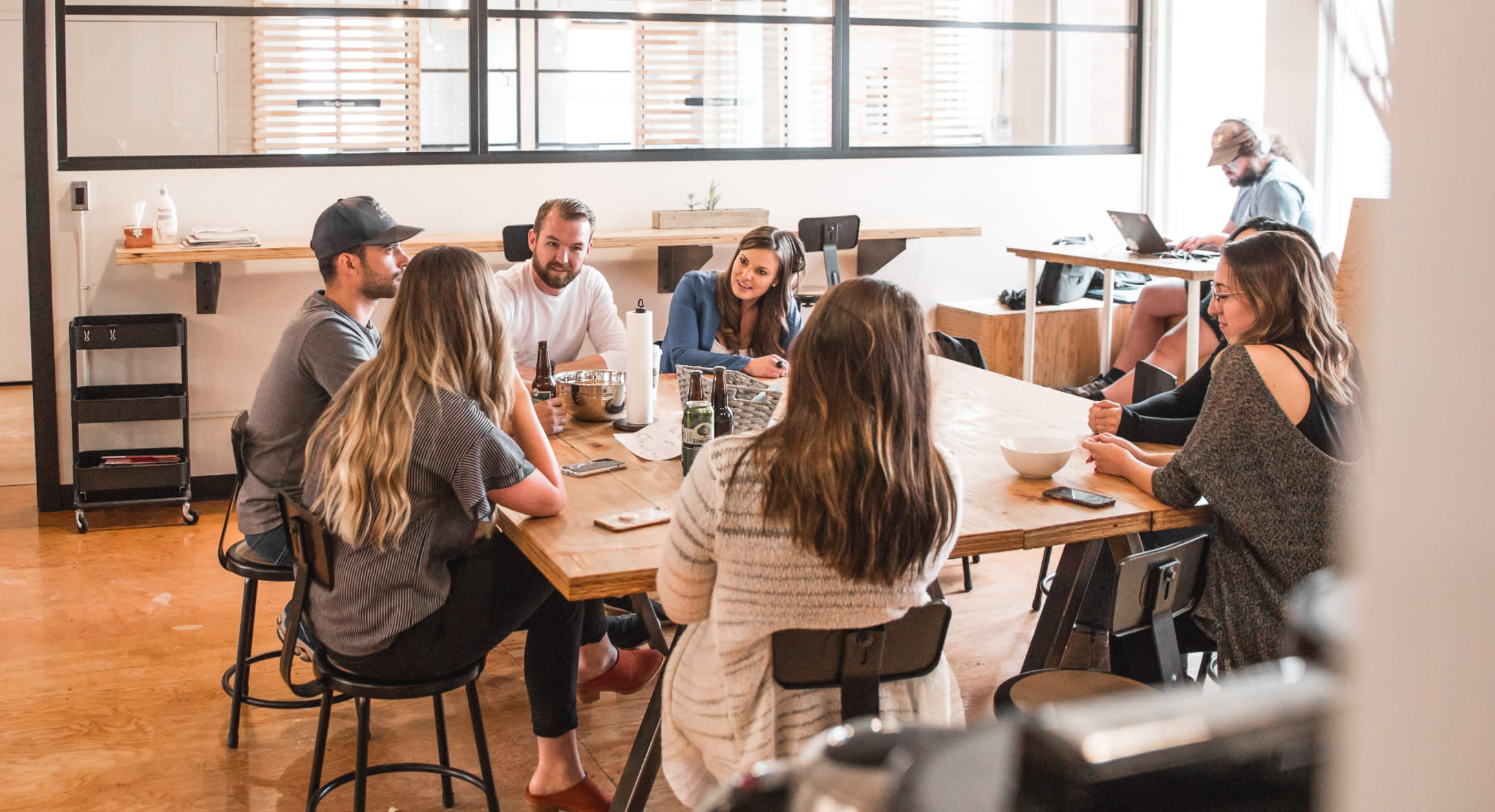 Colleagues gathered around a meeting table